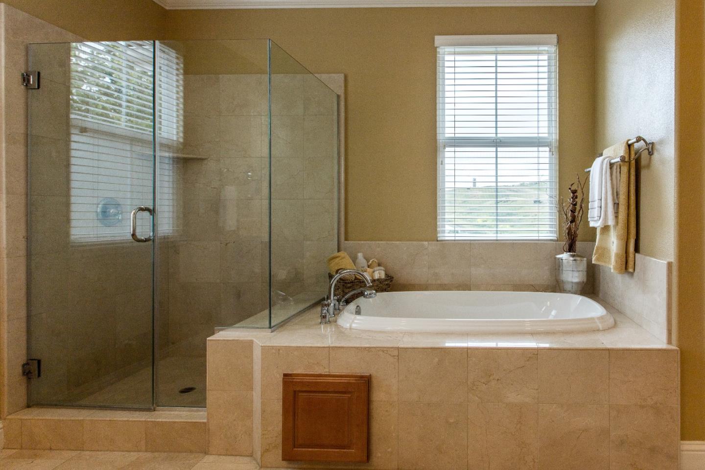 335 Ascente Commons San Jose, CA 95125 - Photo 19 of 38 a bathroom with a sink a mirror and a shower