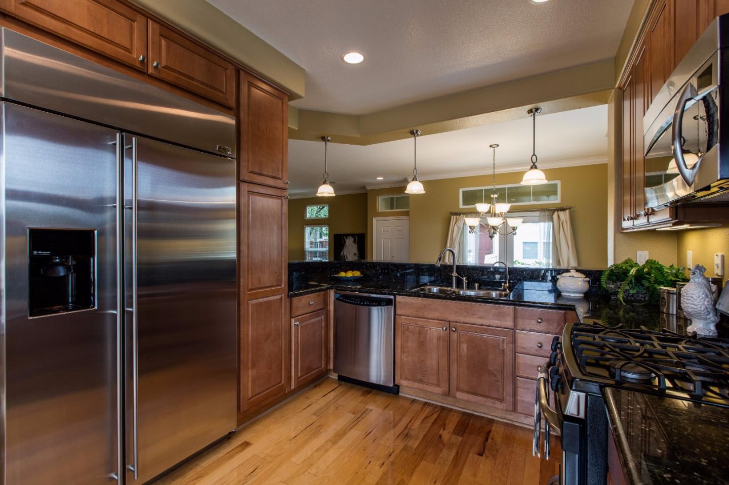 335 Ascente Commons San Jose, CA 95125 - Photo 7 of 38 a kitchen with stainless steel appliances a refrigerator and a stove