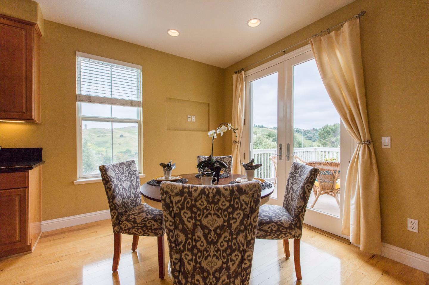 335 Ascente Commons San Jose, CA 95125 - Photo 8 of 38 a dining room with furniture window and wooden floor