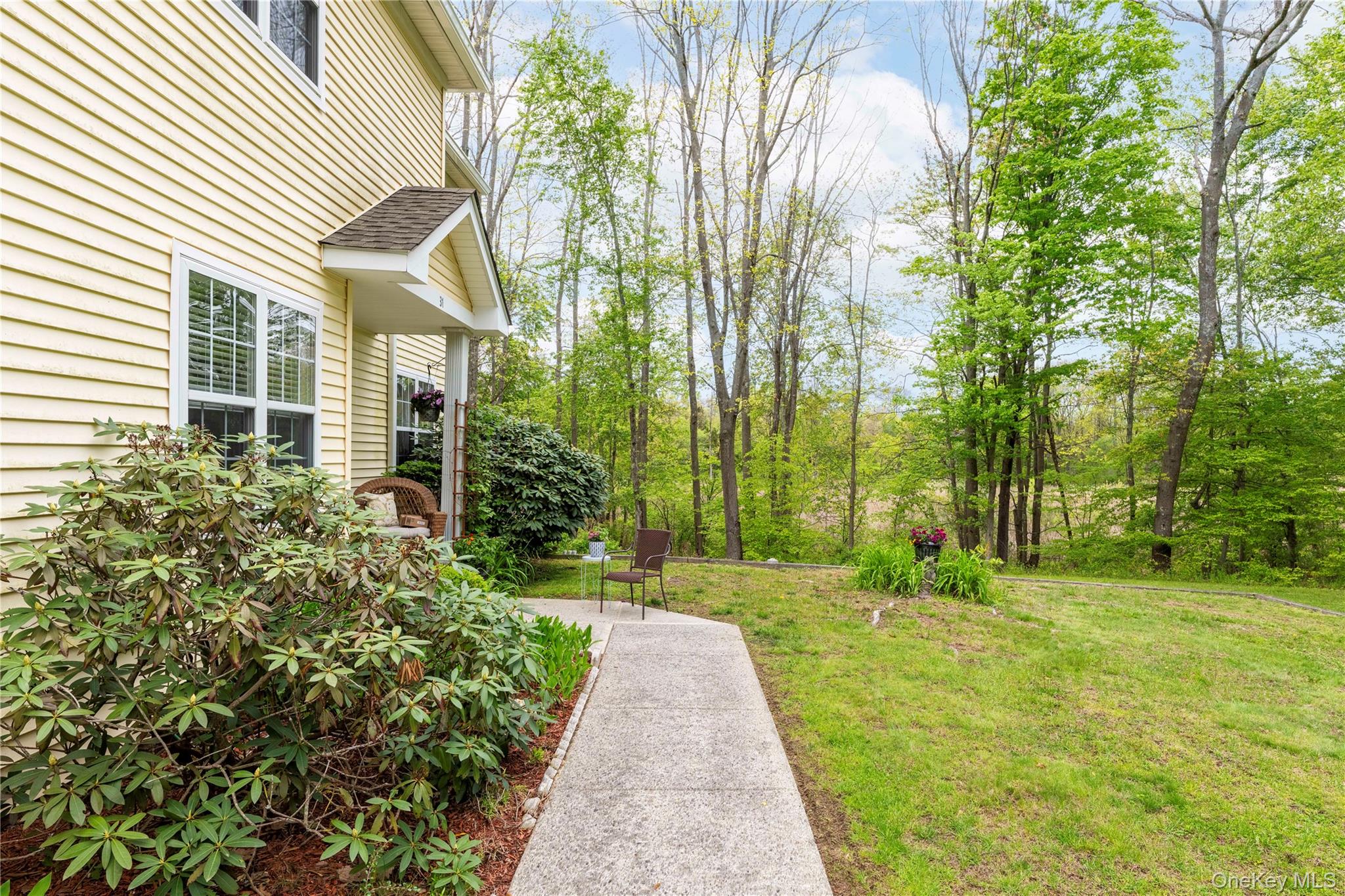 129 Stringham Road, Unit 31 LaGrangeville, NY 12540 - Photo 3 of 26 a view of a back yard of the house