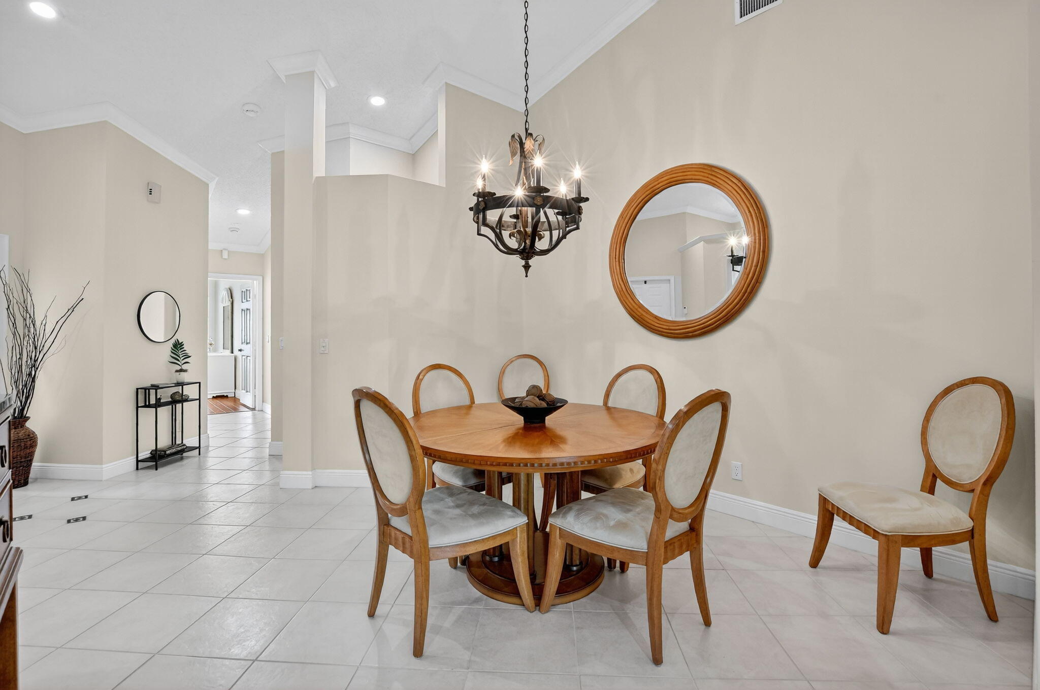 8451 Vía Serena Boca Raton, FL 33433 - Photo 12 of 28 a dining room with furniture and chandelier