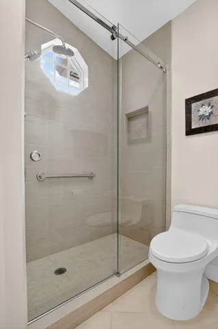 a bathroom with a shower and a toilet