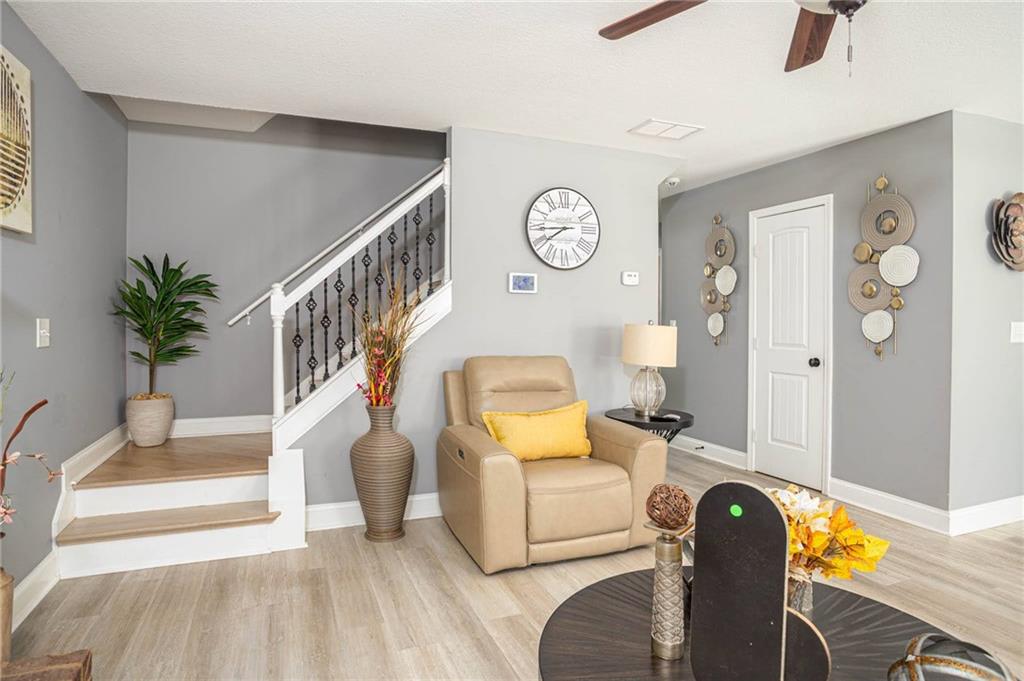 236 Camp Court Bethlehem, GA 30620 - Photo 20 of 51 a living room with furniture and a clock