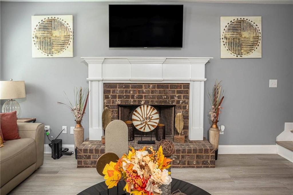 236 Camp Court Bethlehem, GA 30620 - Photo 21 of 51 a living room with furniture and a fireplace