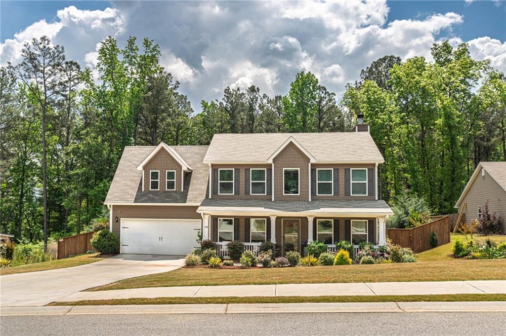 236 Camp Court Bethlehem, GA 30620 - Photo 4 of 51 a front view of a house with a porch