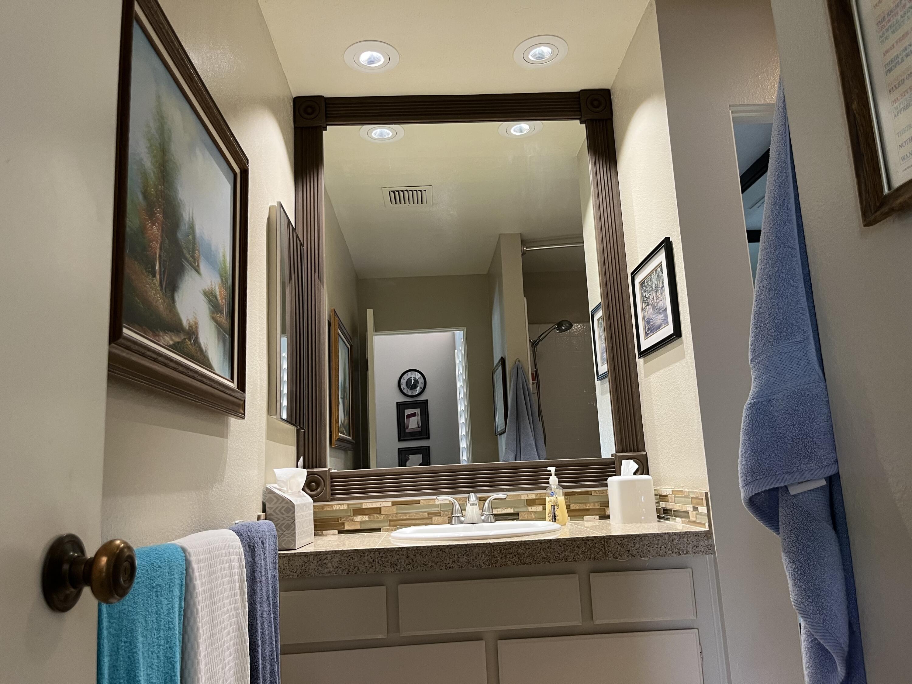 127 South Racquet Club Drive Rancho Mirage, CA 92270 - Photo 16 of 25 a bathroom with a sink and a mirror