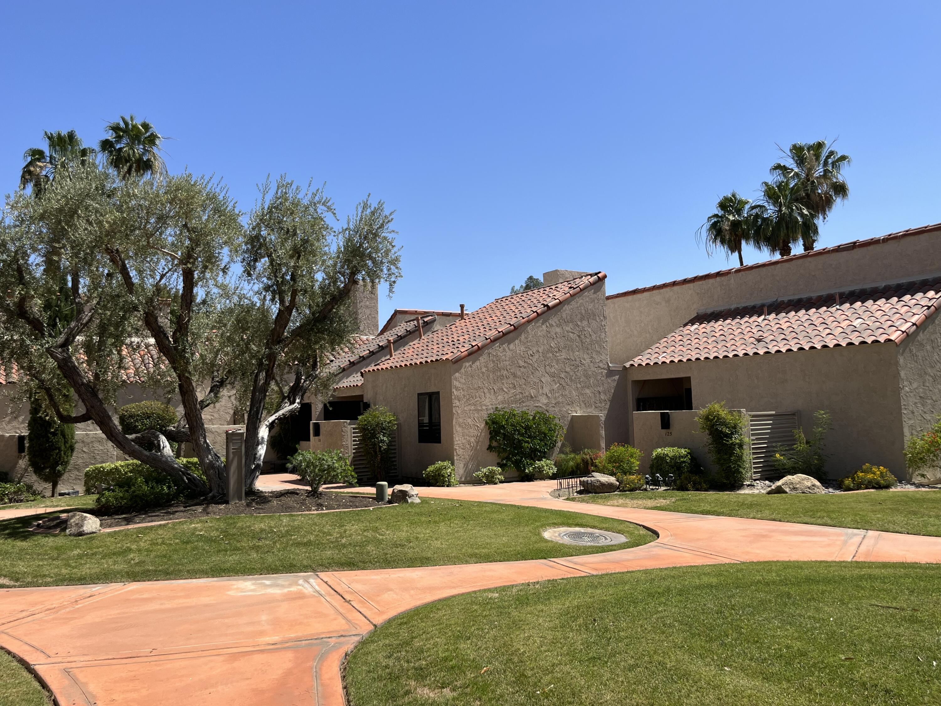 127 South Racquet Club Drive Rancho Mirage, CA 92270 - Photo 20 of 25 a view of a house with backyard and sitting area