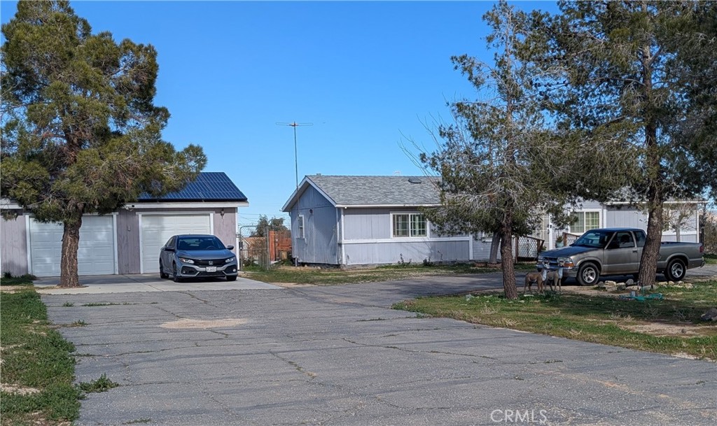 13182 Begonia Road Victorville, CA 92392 - Photo 16 of 17 a view of a parked cars in front of a house