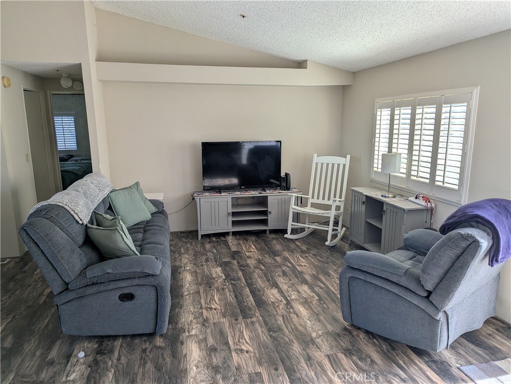 13182 Begonia Road Victorville, CA 92392 - Photo 4 of 17 a living room with furniture and a flat screen tv