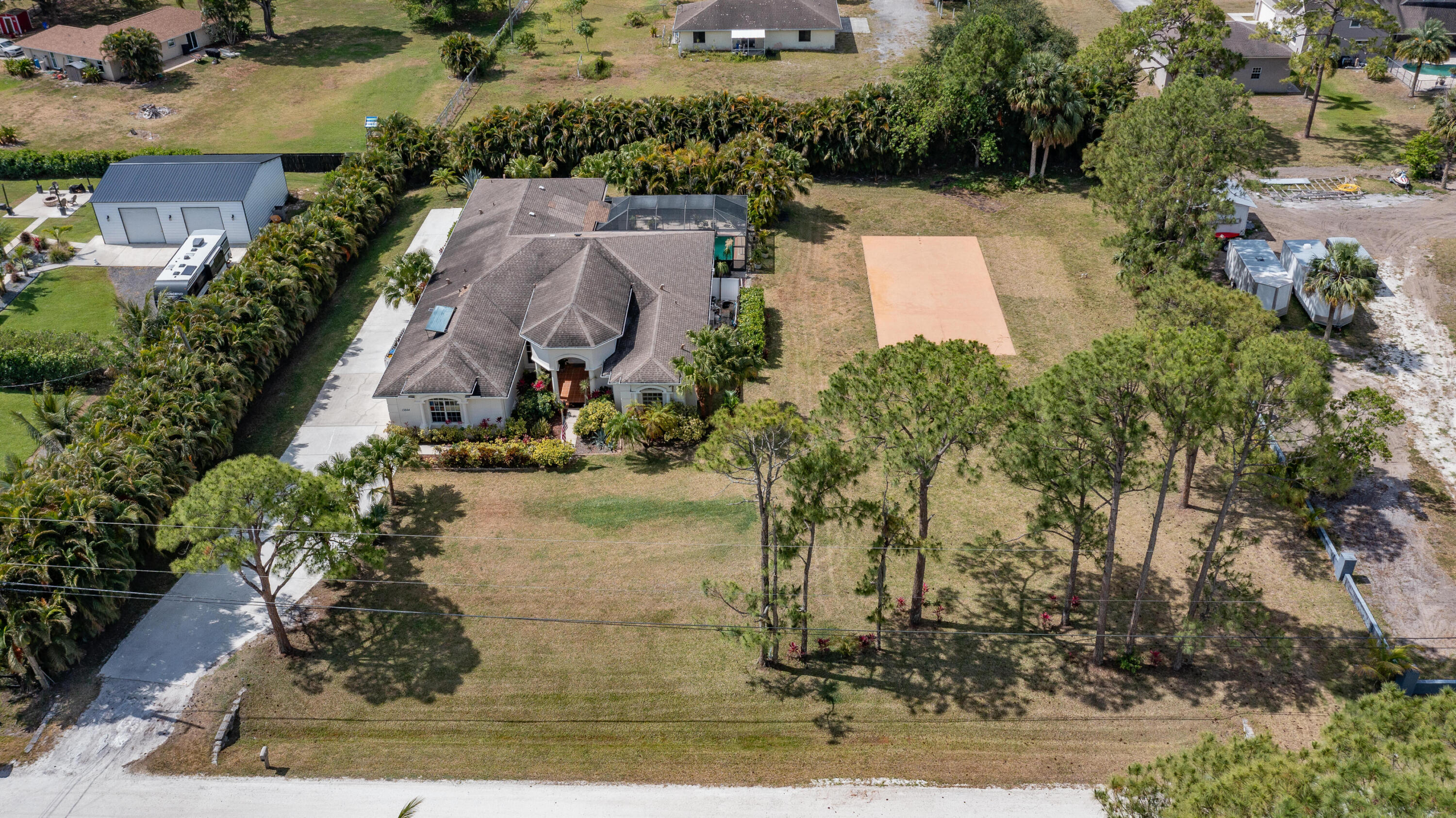 13554 86th Road North West Palm Beach, FL 33412 - Photo 18 of 58 an aerial view of a house with a yard basket ball court and outdoor seating