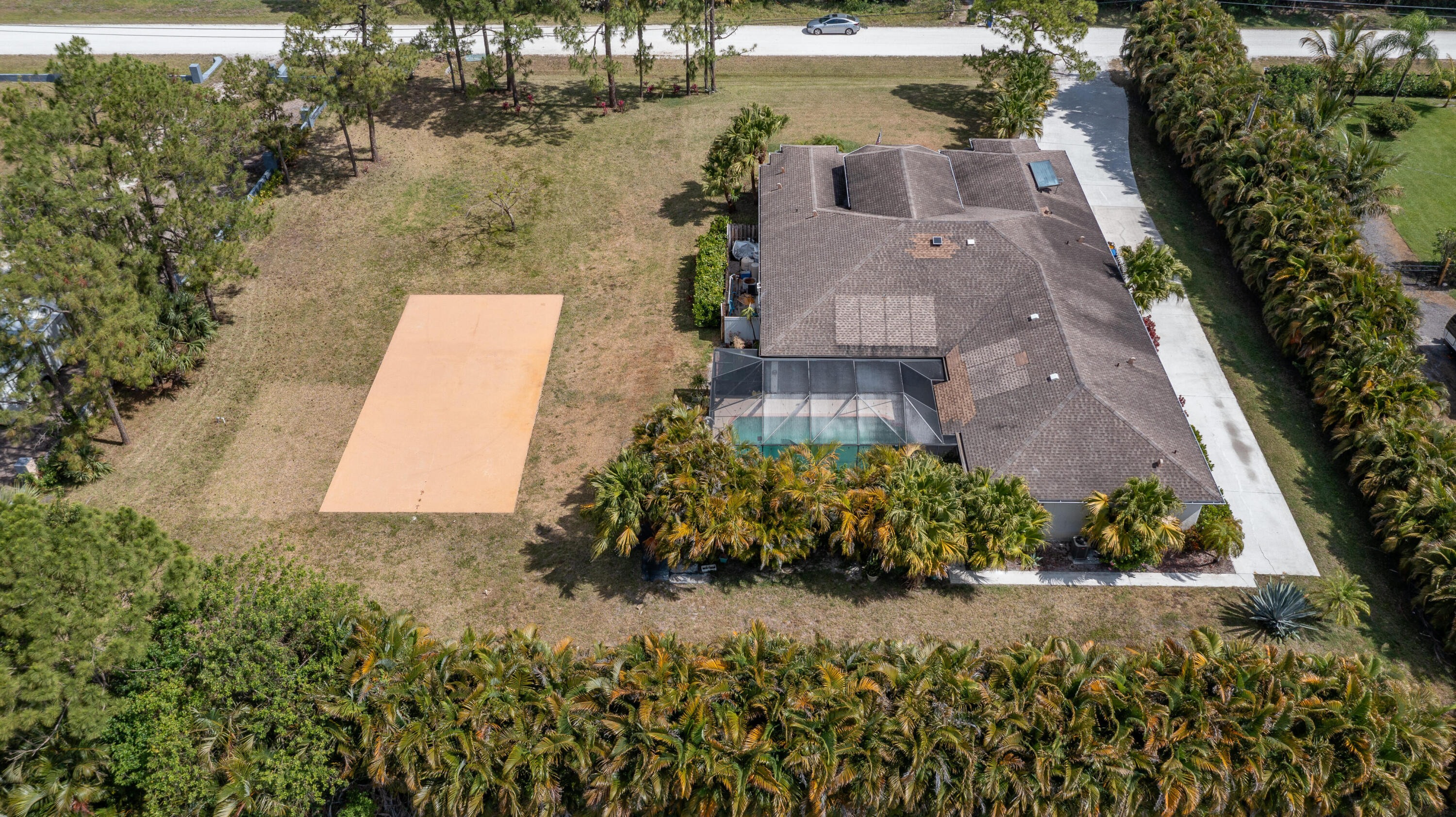 13554 86th Road North West Palm Beach, FL 33412 - Photo 19 of 58 an aerial view of a house with a yard and lake view