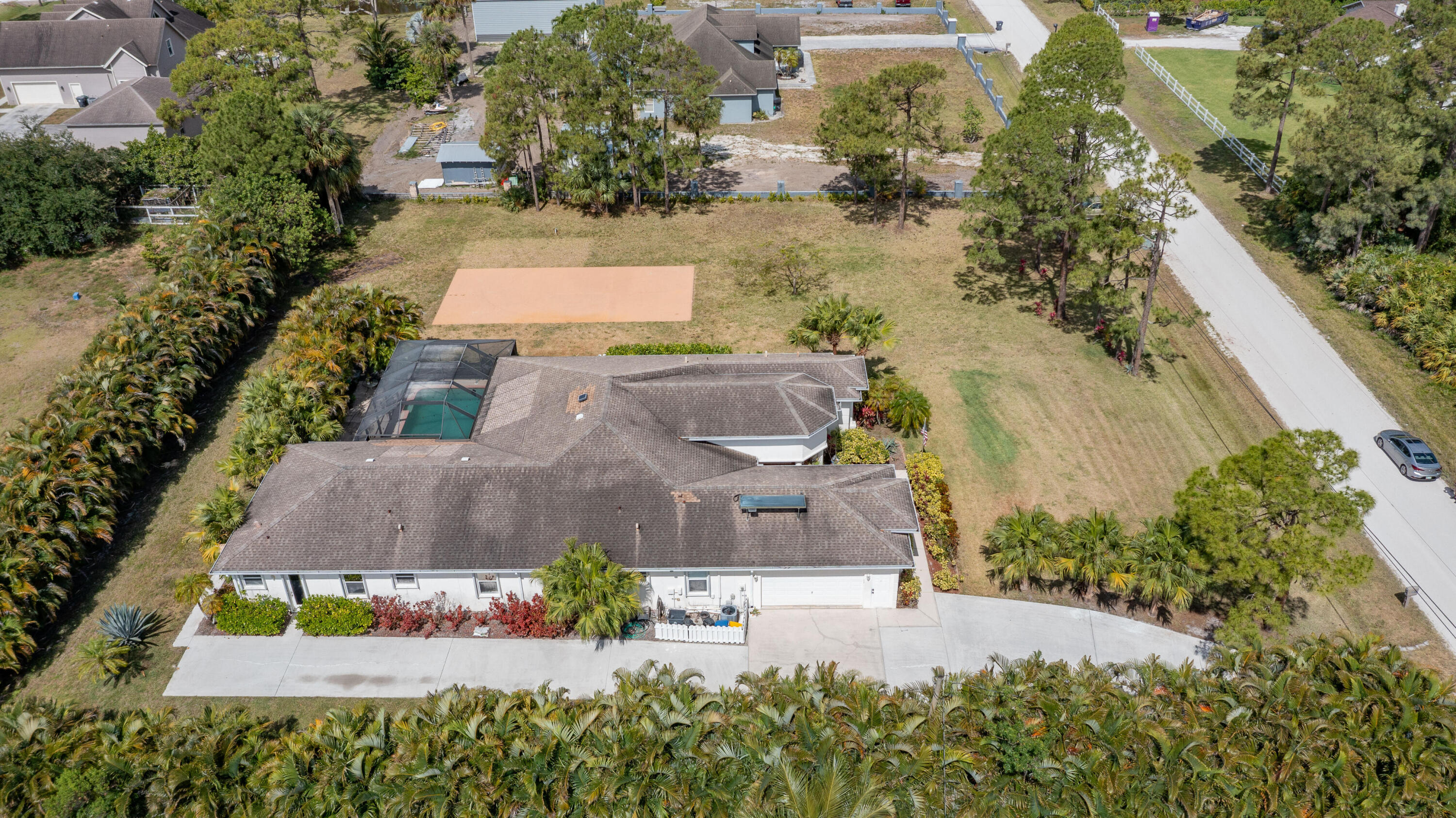 13554 86th Road North West Palm Beach, FL 33412 - Photo 21 of 58 an aerial view of a house with a garden