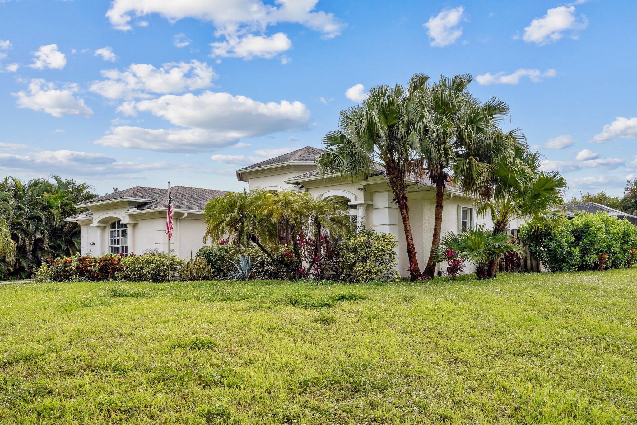 13554 86th Road North West Palm Beach, FL 33412 - Photo 27 of 58 a view of a house with a yard