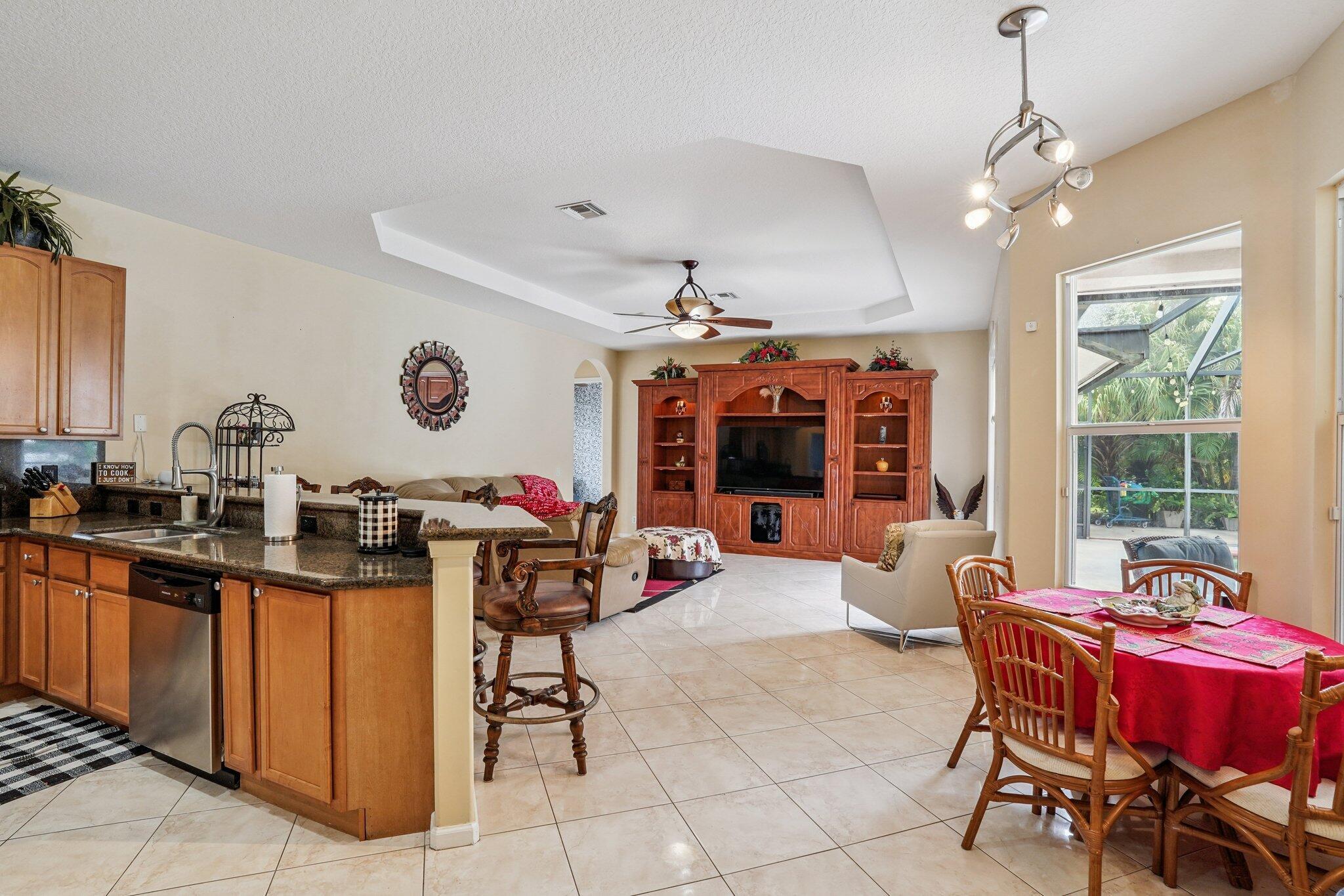 13554 86th Road North West Palm Beach, FL 33412 - Photo 30 of 58 a living room with furniture a window and a table