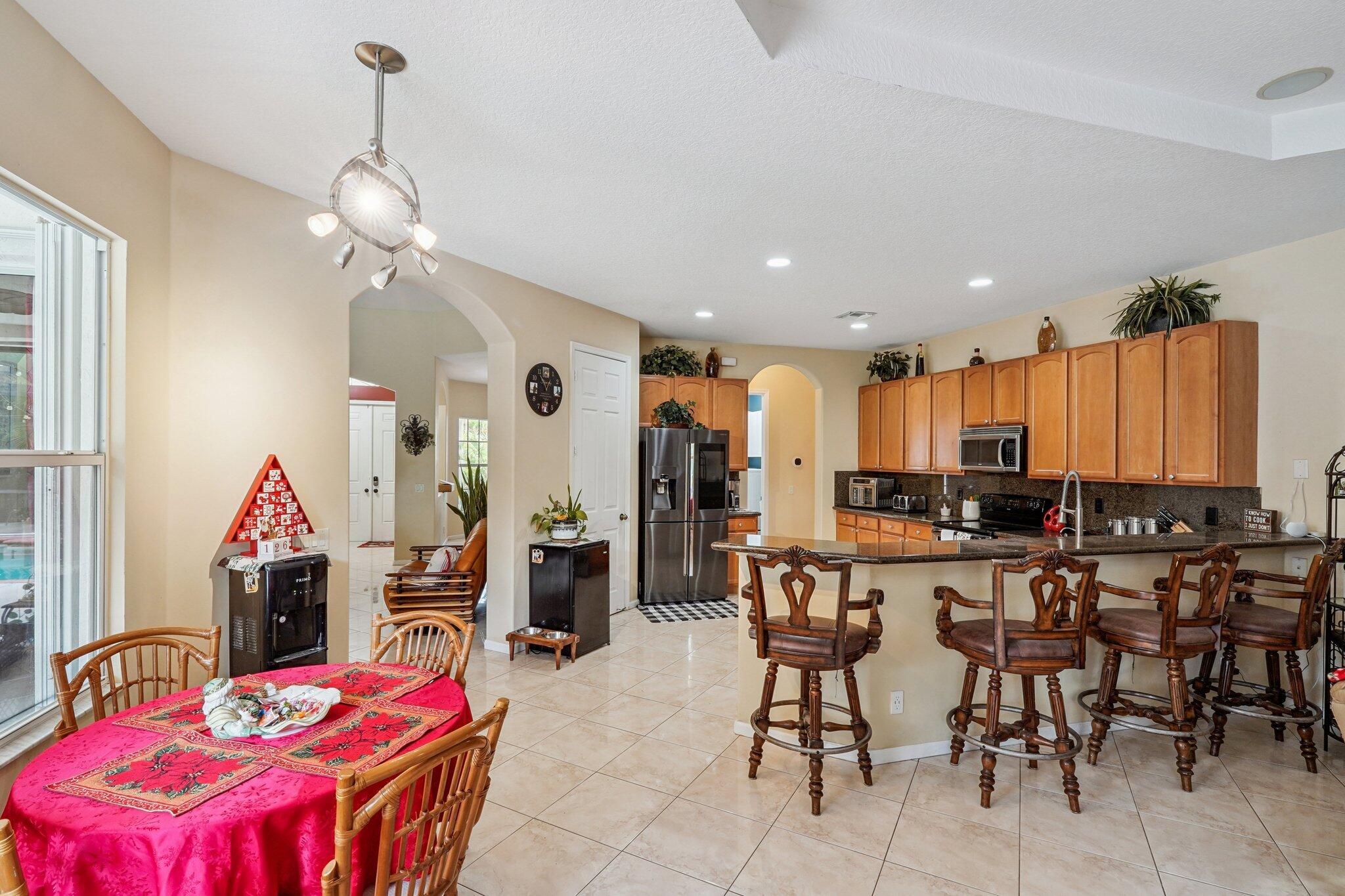 13554 86th Road North West Palm Beach, FL 33412 - Photo 32 of 58 a view of a dining room with furniture