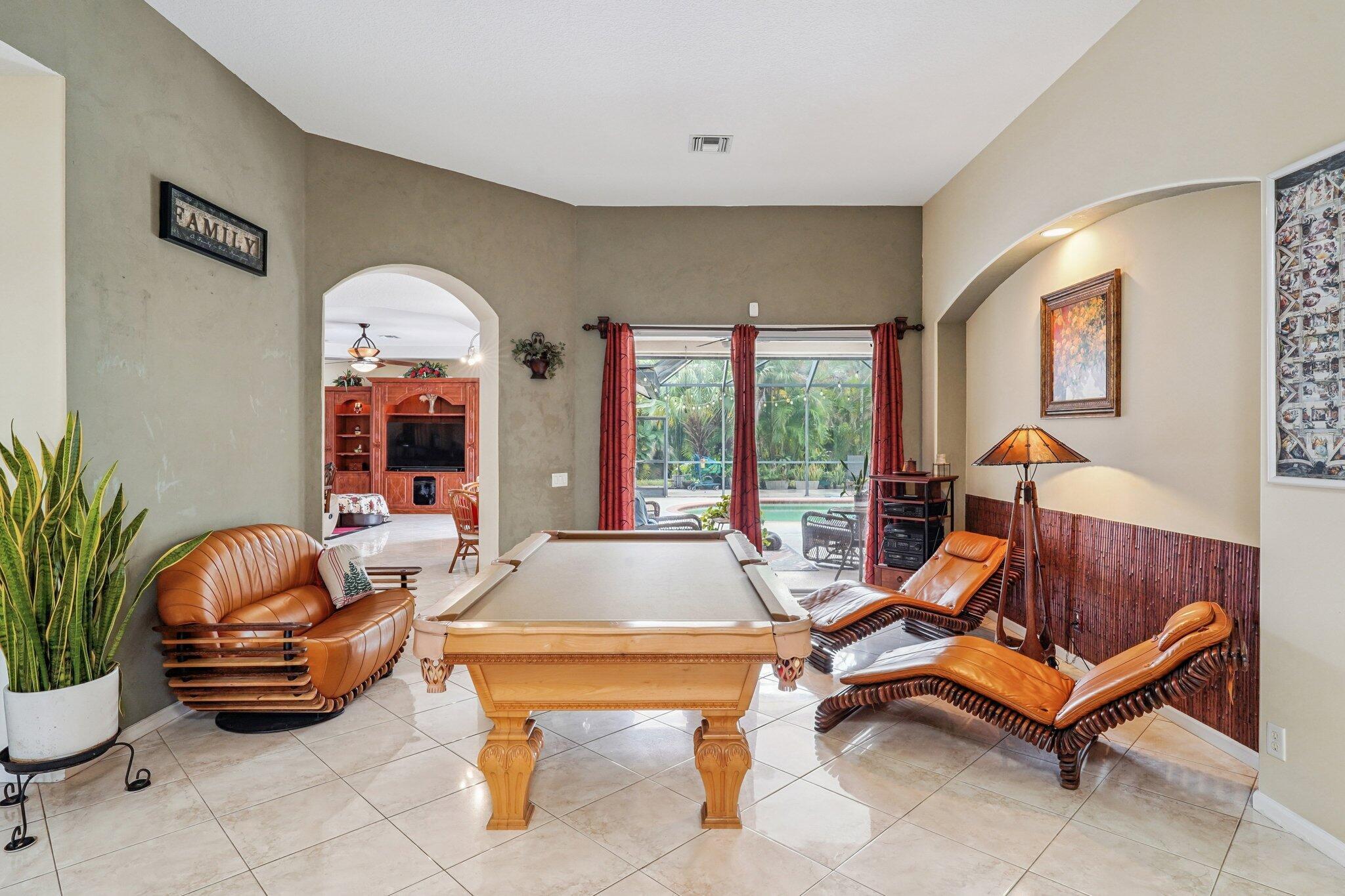 13554 86th Road North West Palm Beach, FL 33412 - Photo 33 of 58 a living room with furniture and a potted plant