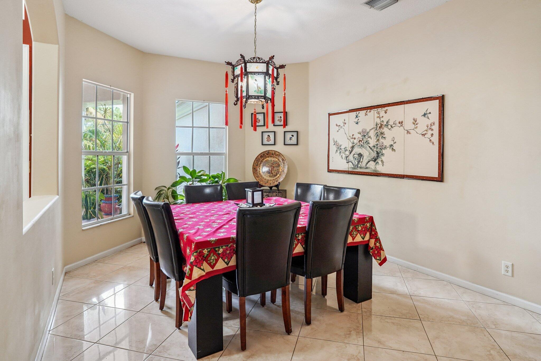 13554 86th Road North West Palm Beach, FL 33412 - Photo 35 of 58 a view of a dining room with furniture and window