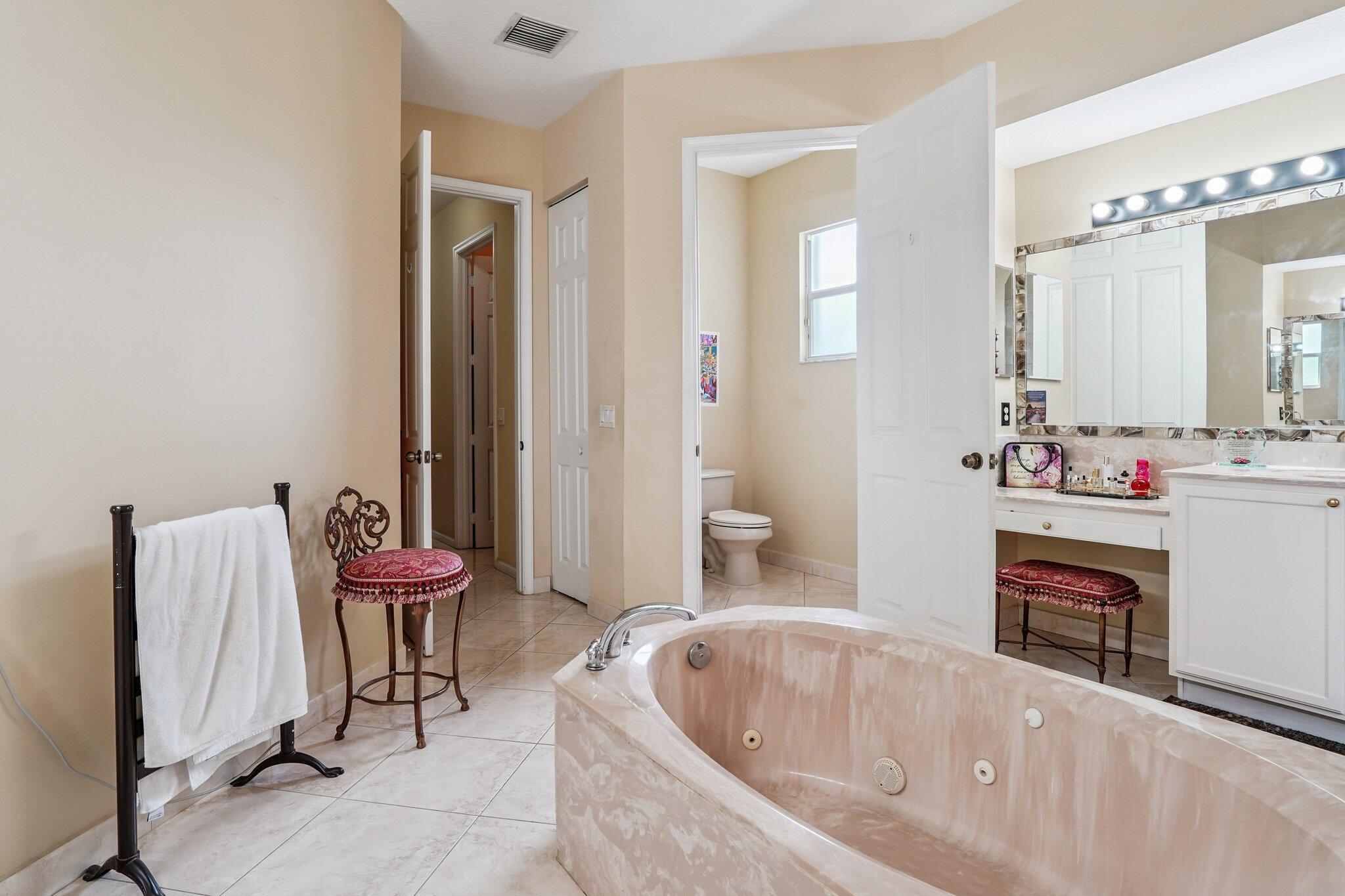 13554 86th Road North West Palm Beach, FL 33412 - Photo 42 of 58 a bathroom with a tub sink and toilet