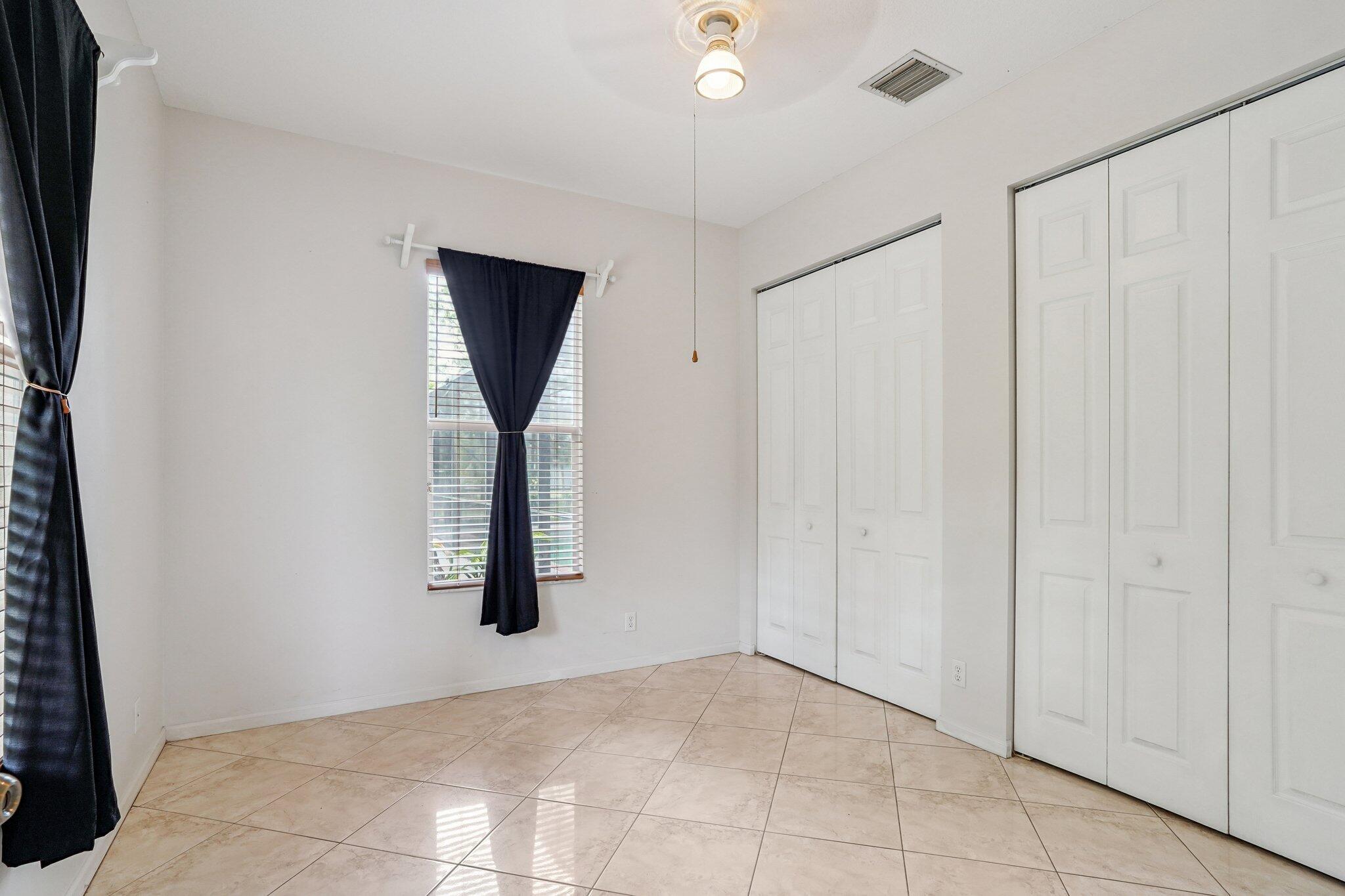 13554 86th Road North West Palm Beach, FL 33412 - Photo 54 of 58 a view of a livingroom with wooden floor and cabinet