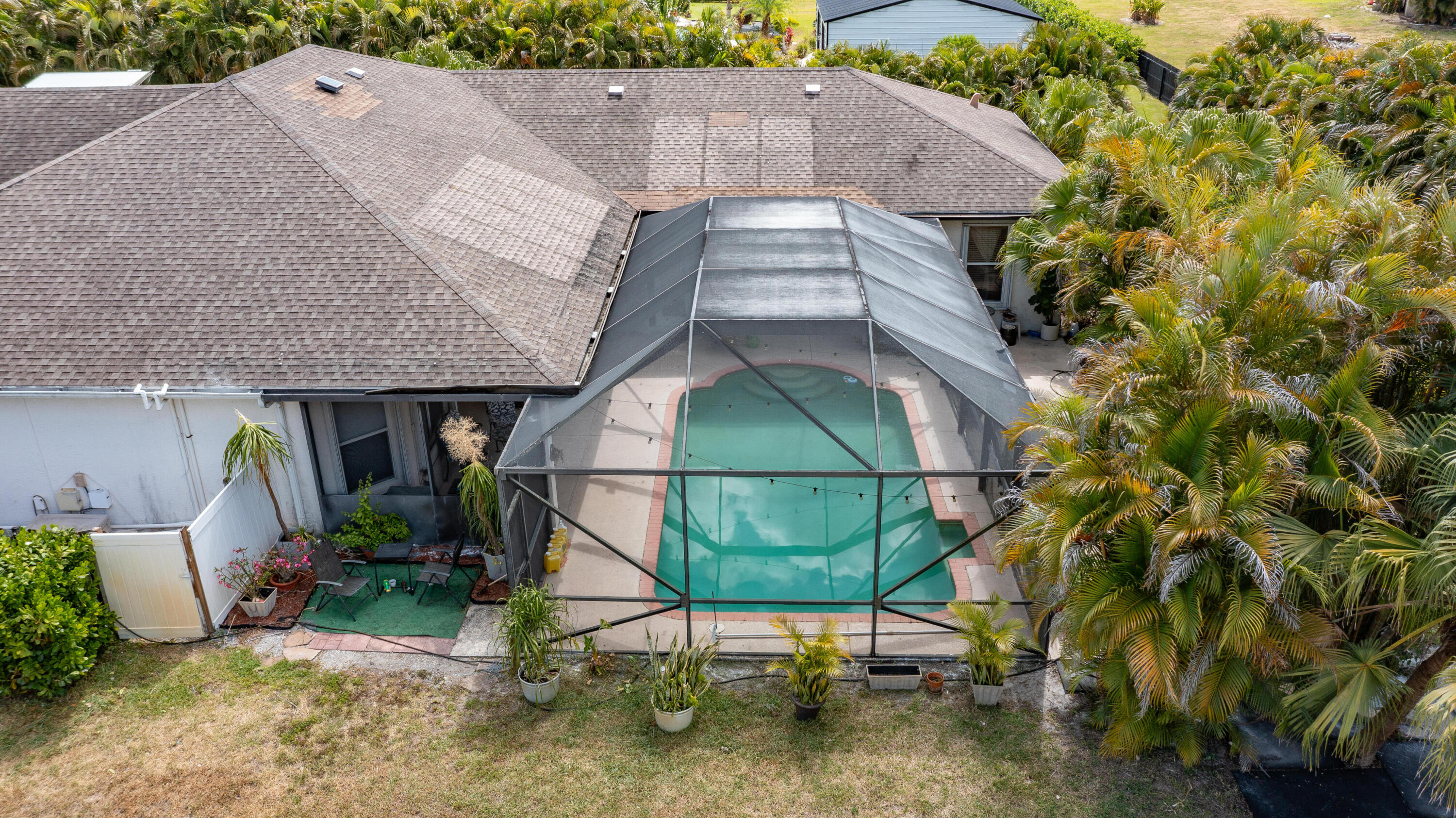 13554 86th Road North West Palm Beach, FL 33412 - Photo 8 of 58 an aerial view of a house with table and chairs