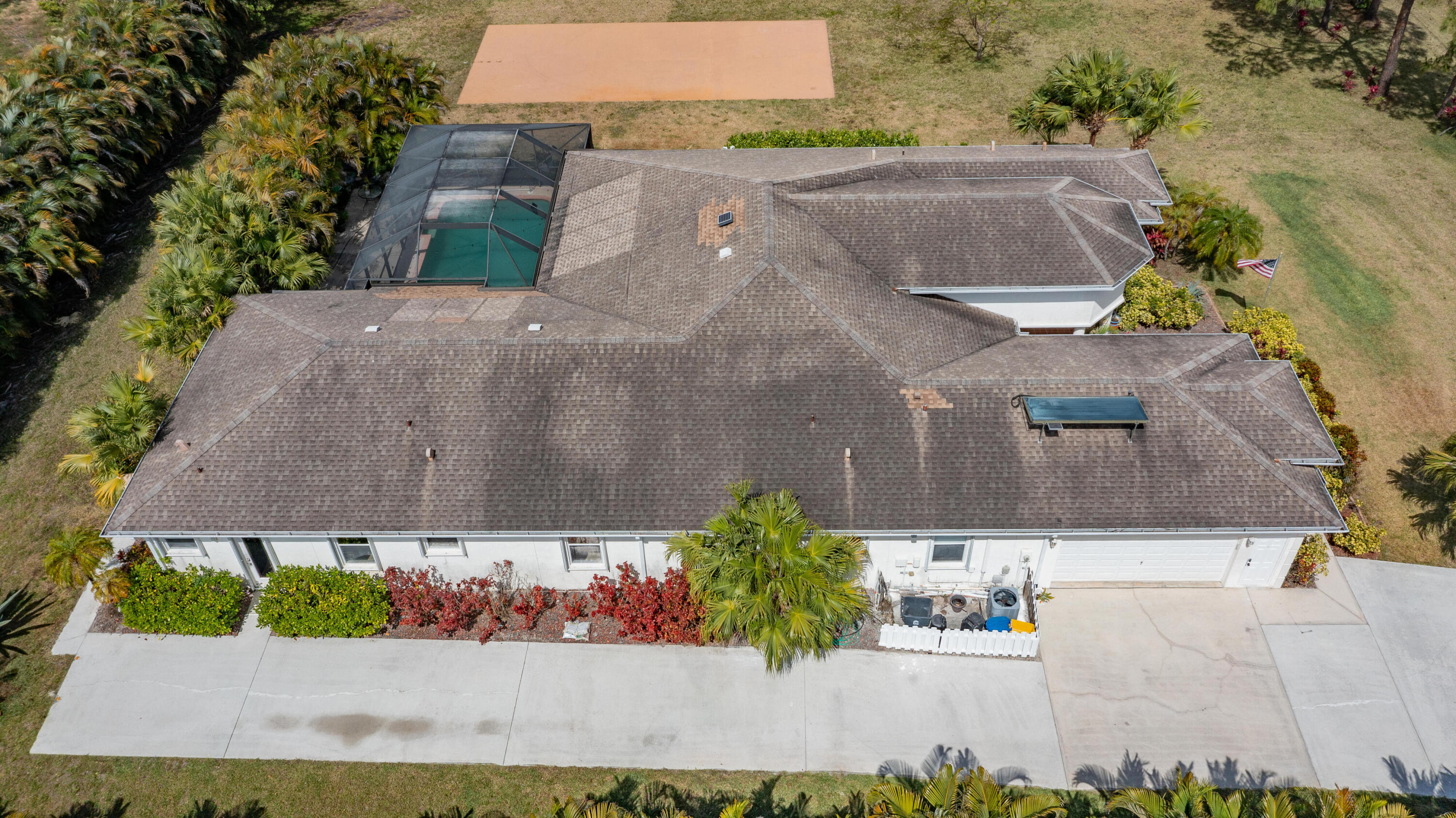 13554 86th Road North West Palm Beach, FL 33412 - Photo 10 of 58 an aerial view of a house with a yard