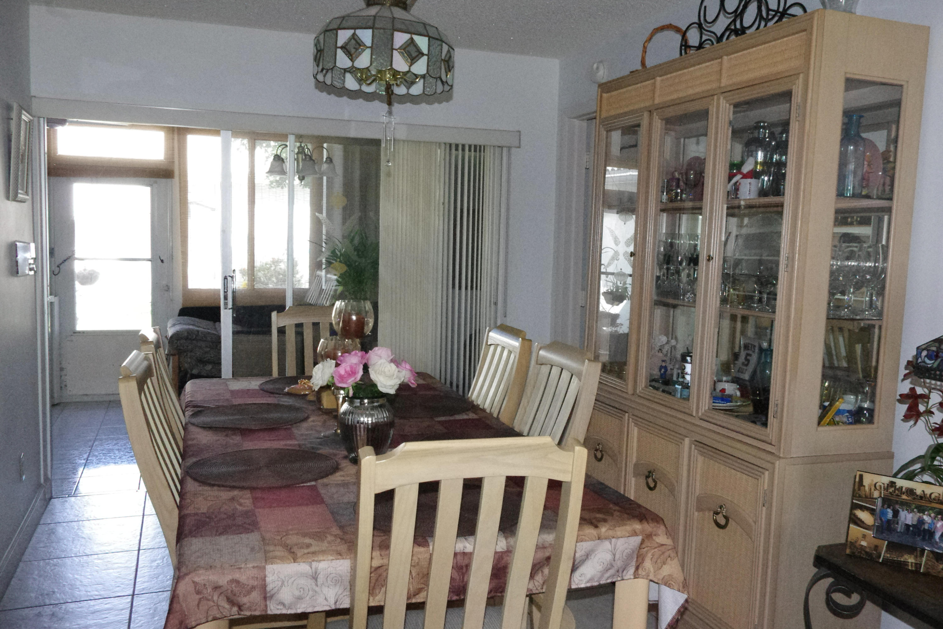 1310 Southwest 22nd Street Boynton Beach, FL 33426 - Photo 11 of 16 a view of a dining room with furniture window and outside view