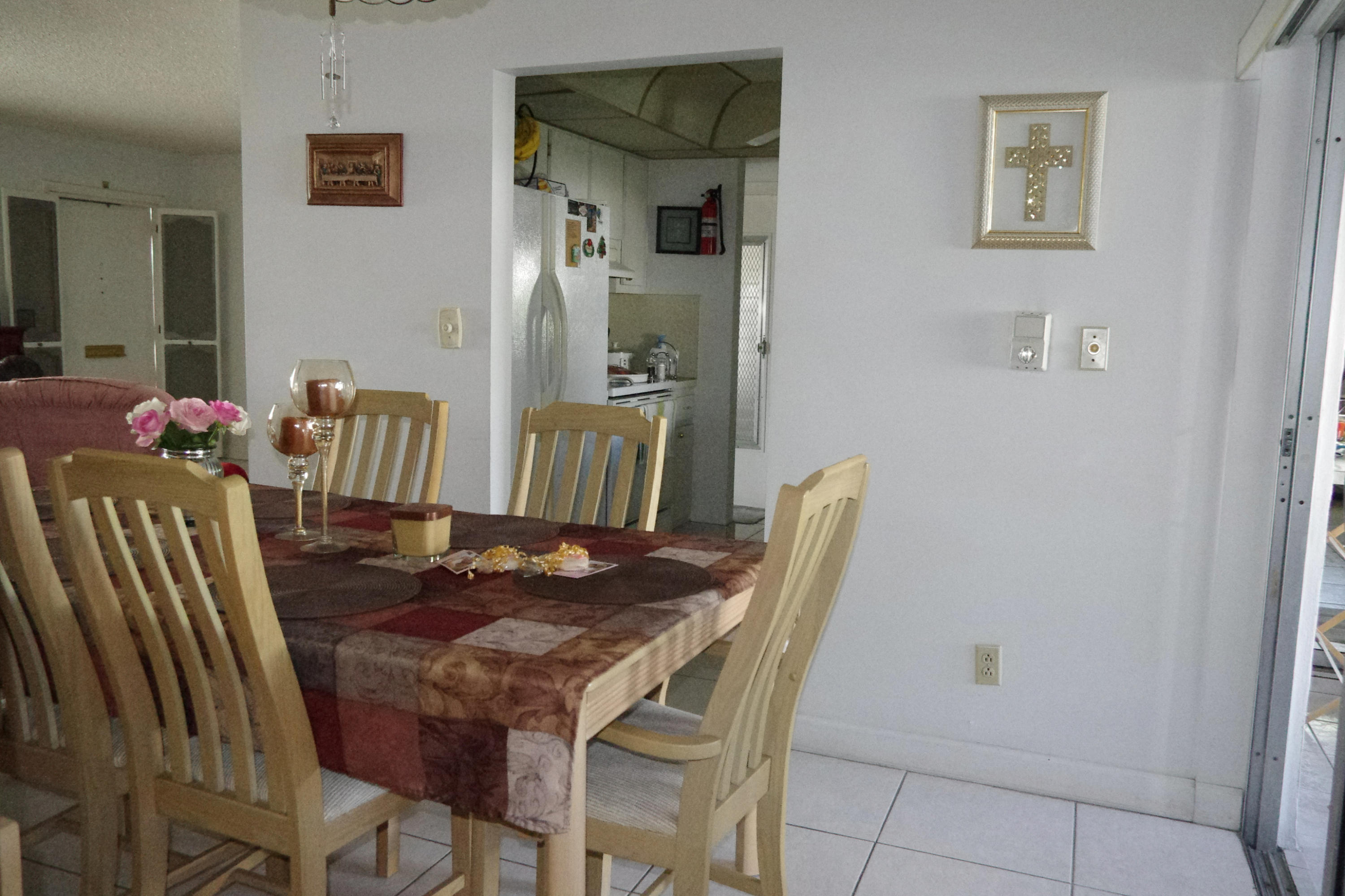 1310 Southwest 22nd Street Boynton Beach, FL 33426 - Photo 12 of 16 a view of a dining room with furniture