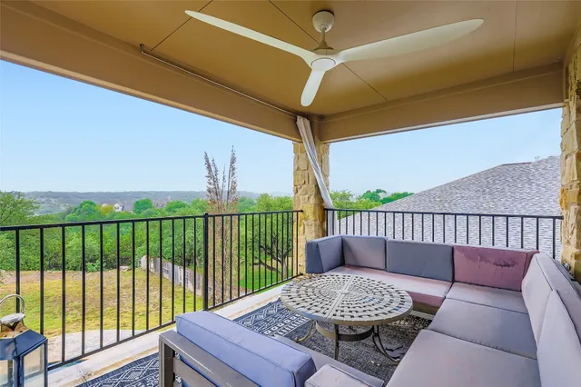 a room with pool table and windows