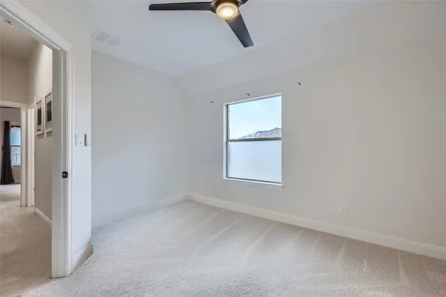 a bathroom with a shower sink vanity mirror and toilet
