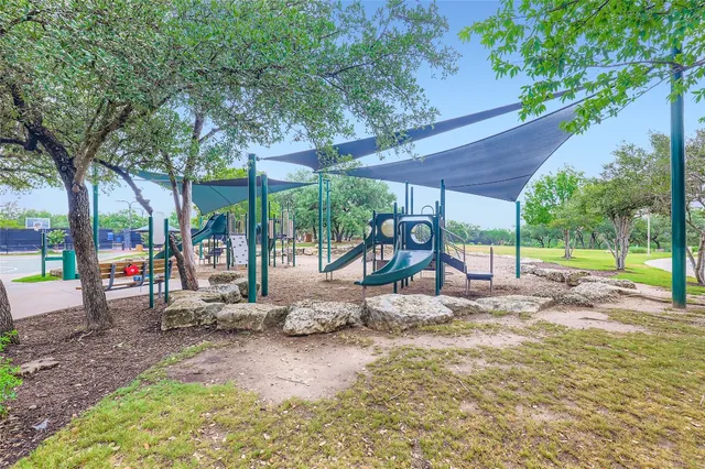 a view of a swimming pool with a patio