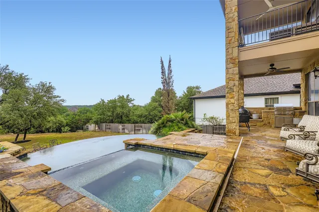a view of a swimming pool with a lounge chair
