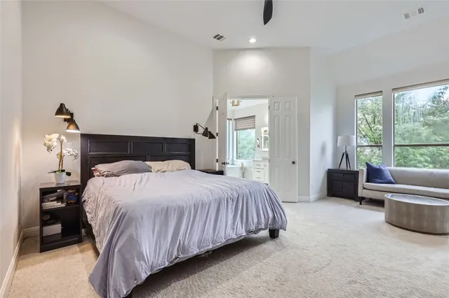 a bedroom with a bed and a couch