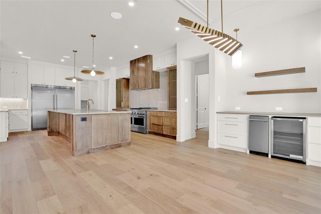 1839 Sentinel Way Tyler, TX 75703 - Photo 11 of 40 a open kitchen with white cabinets and stainless steel appliances