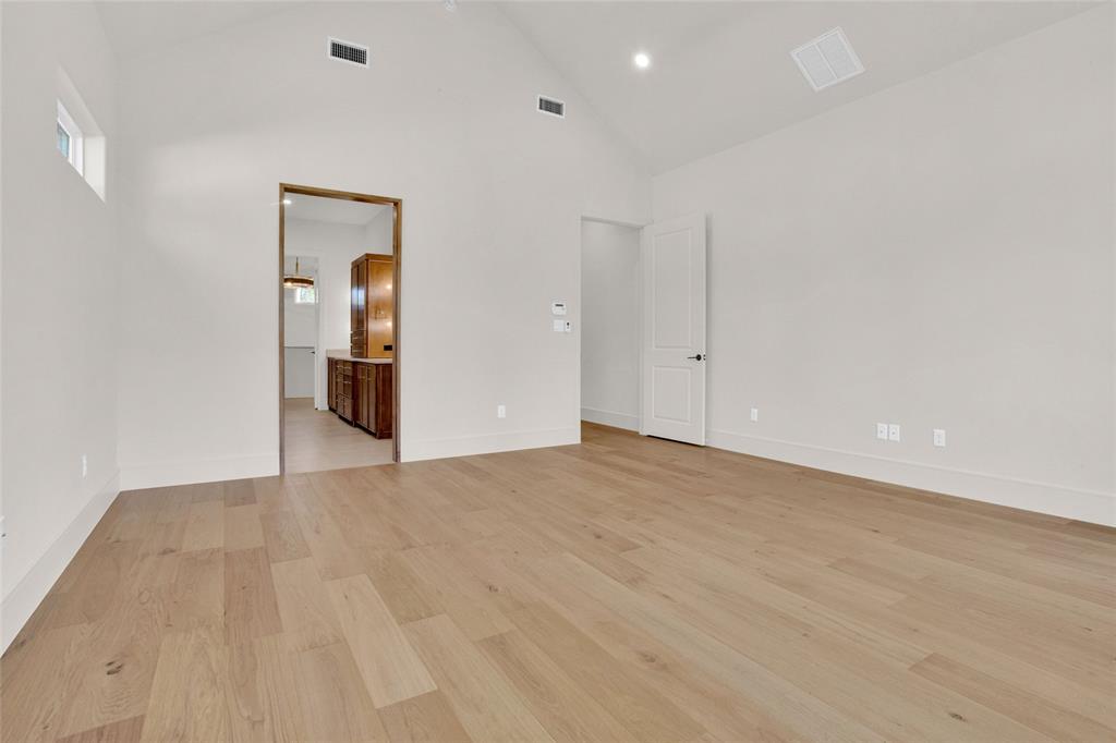 1839 Sentinel Way Tyler, TX 75703 - Photo 15 of 40 a view of an empty room with wooden floor and closet