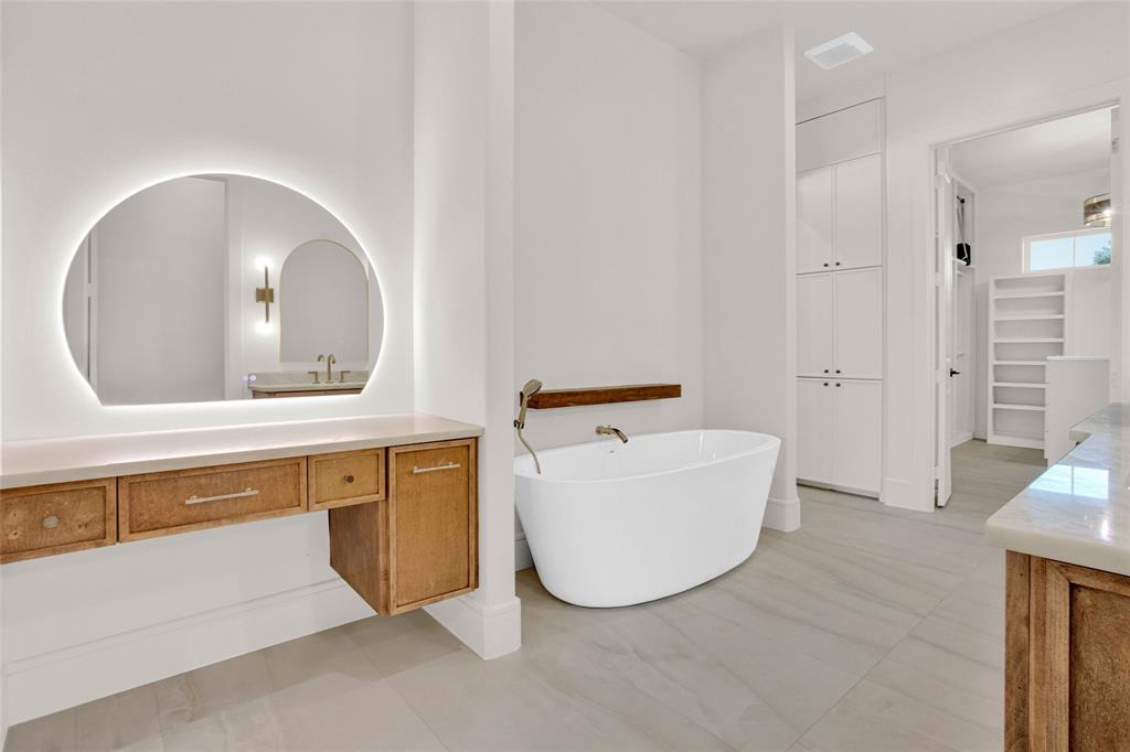 1839 Sentinel Way Tyler, TX 75703 - Photo 16 of 40 a bathroom with a sink mirror and bathtub