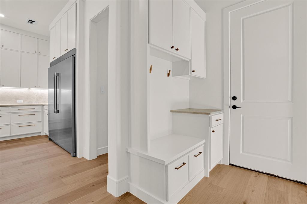 1839 Sentinel Way Tyler, TX 75703 - Photo 25 of 40 a view of cabinets with wooden floor