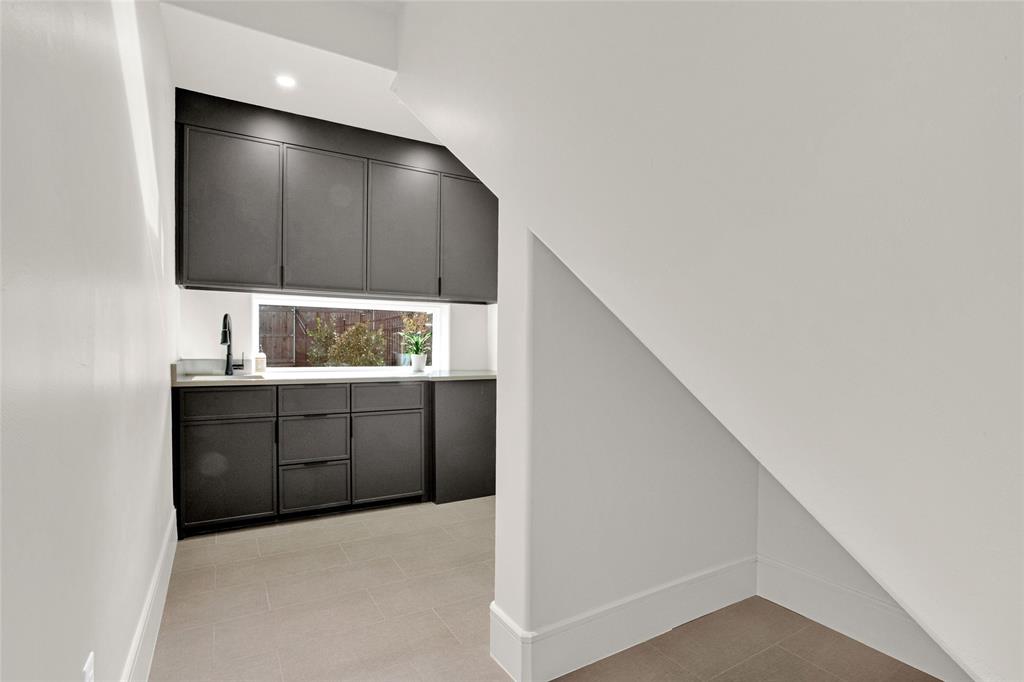 1839 Sentinel Way Tyler, TX 75703 - Photo 27 of 40 a kitchen with a sink and a mirror