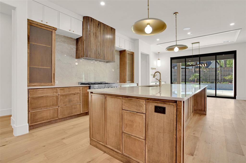 1839 Sentinel Way Tyler, TX 75703 - Photo 6 of 40 a kitchen with granite countertop a sink and a refrigerator
