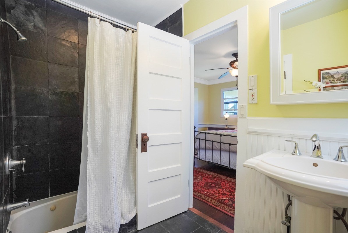 4378 Hookui Road Kilauea, HI 96754 - Photo 10 of 29 a bathroom with a sink a toilet and shower