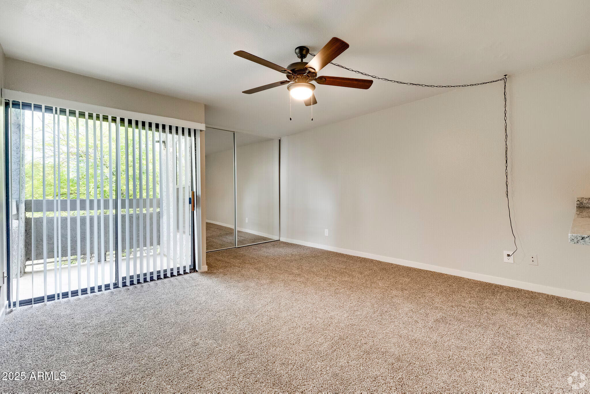 6505 East Osborn Road, Unit 22 Scottsdale, AZ 85251 - Photo 2 of 9 a view of an empty room with a window