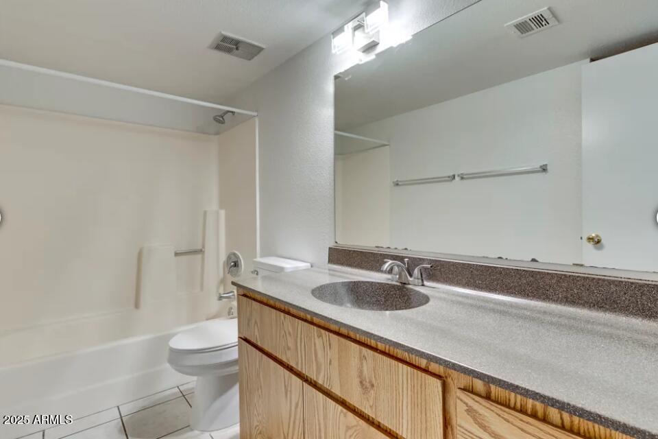 6505 East Osborn Road, Unit 22 Scottsdale, AZ 85251 - Photo 6 of 9 a bathroom with a sink a toilet and shower