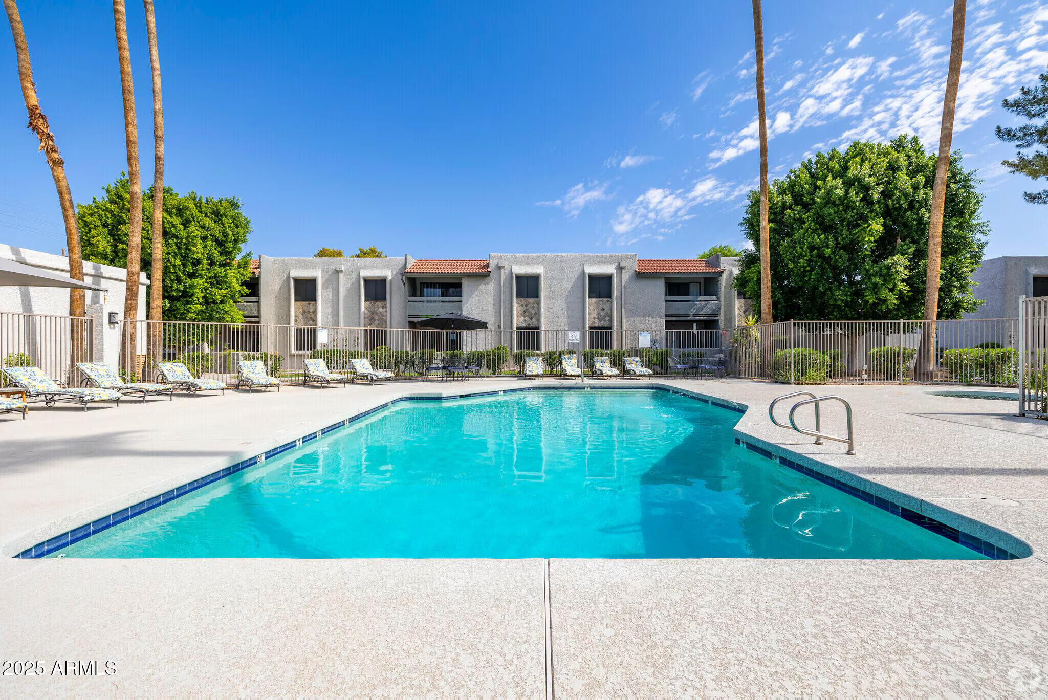 6505 East Osborn Road, Unit 22 Scottsdale, AZ 85251 - Photo 7 of 9 a swimming pool with outdoor seating and yard