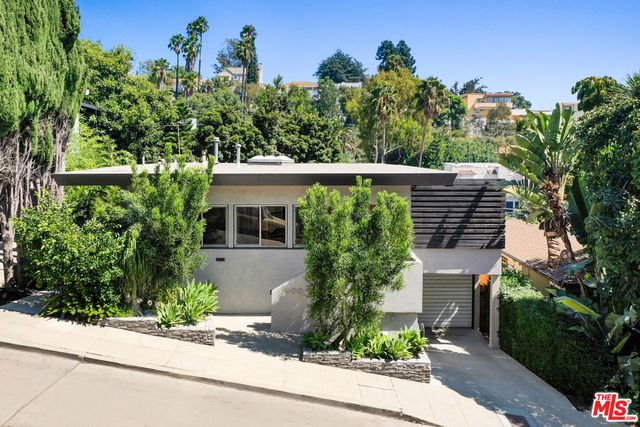 a house view with a garden space