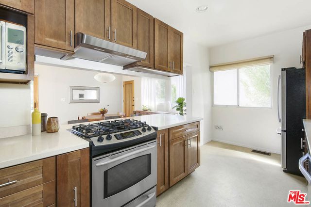 a bathroom with a sink a mirror and a window