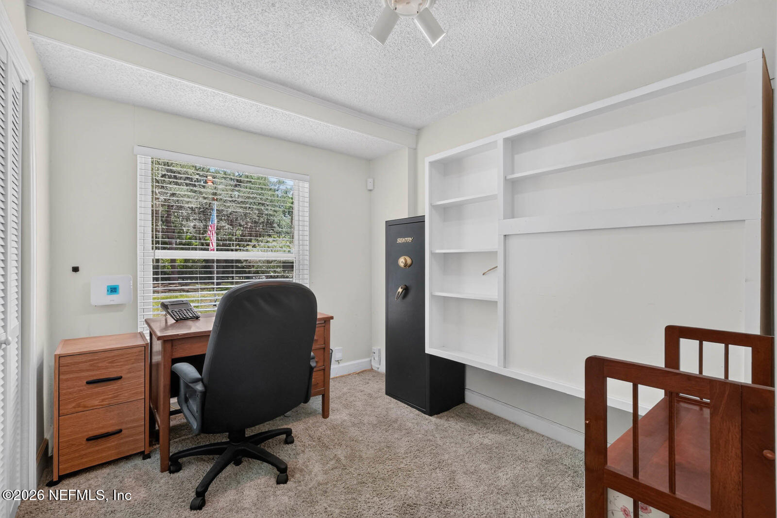 1950 Lightsey Road St. Augustine, FL 32084 - Photo 23 of 57 a view of a workspace with furniture and a window