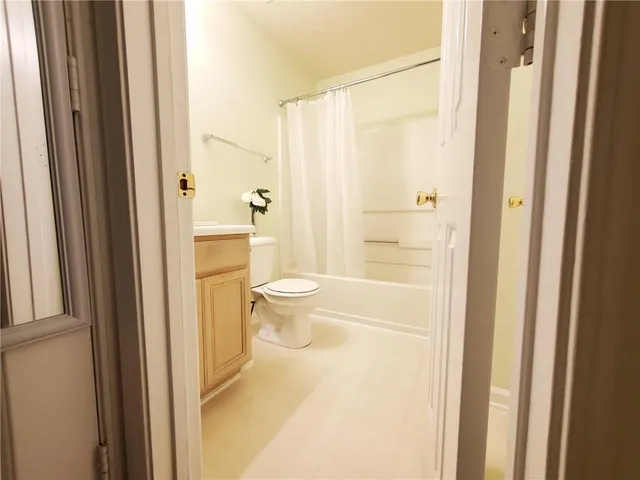 a bathroom with a granite countertop sink