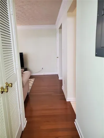 a view of a room with wooden floor