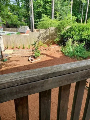 a view of a backyard of the house
