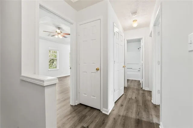 wooden floor with white walls