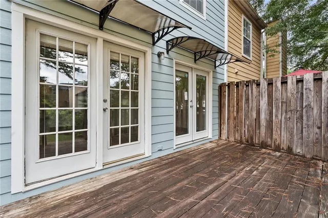 a view of a brick house with a large window
